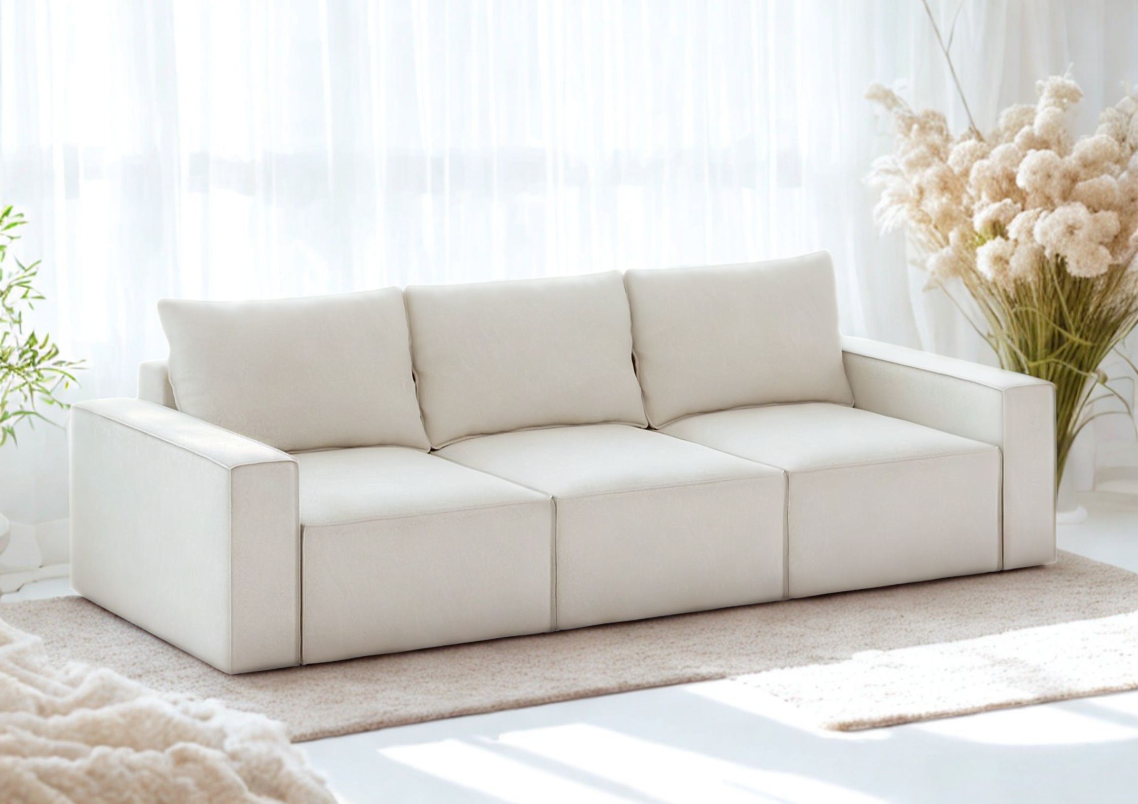 Beżowa sofa w stylu loft z przeszyciami